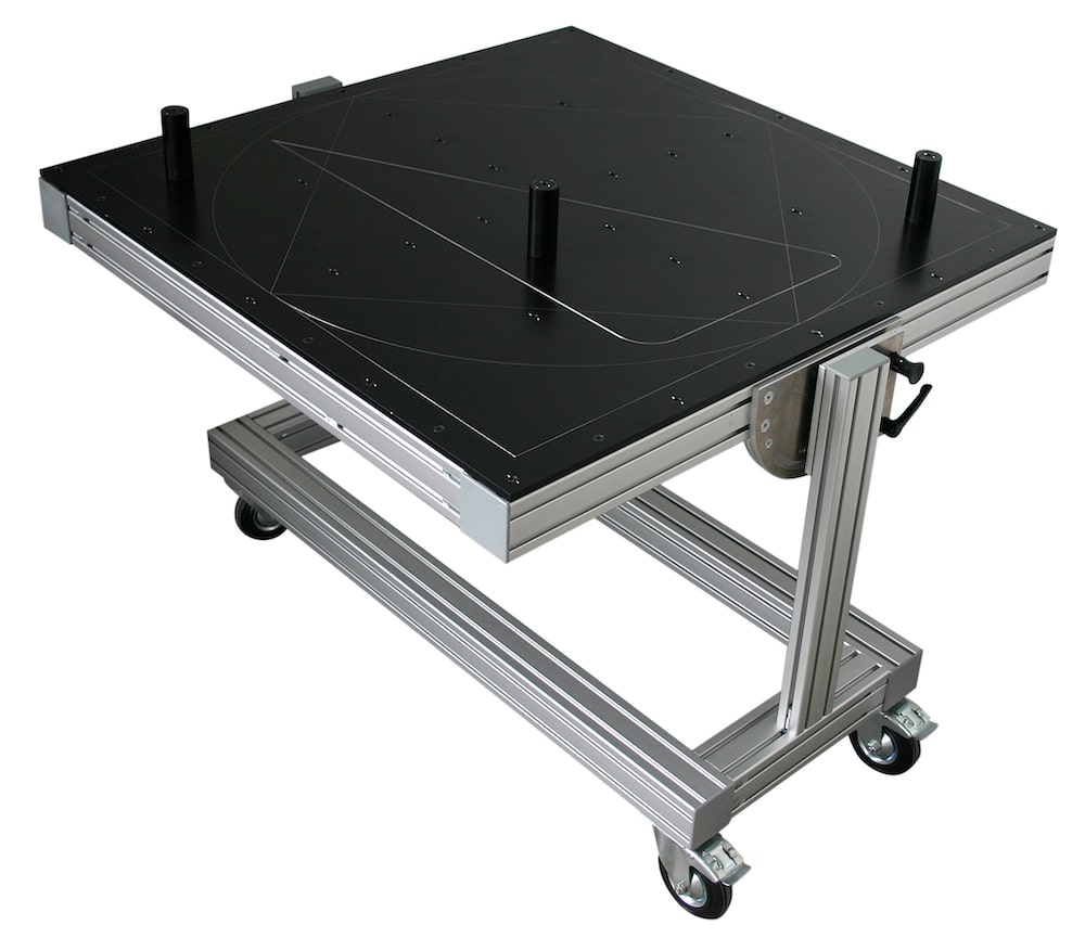 Black SL laser certification tool on a mobile aluminum frame – calibration system with markings for precise adjustment of laser projectors. Horizontal view.