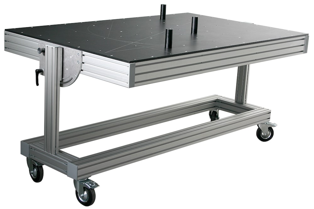 Black SL laser certification tool on a mobile aluminum frame – calibration system with markings for precise adjustment of laser projectors. Horizontal view in detail.